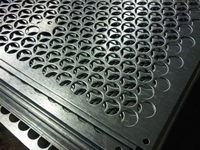 CNC punched speaker grilles with round holes